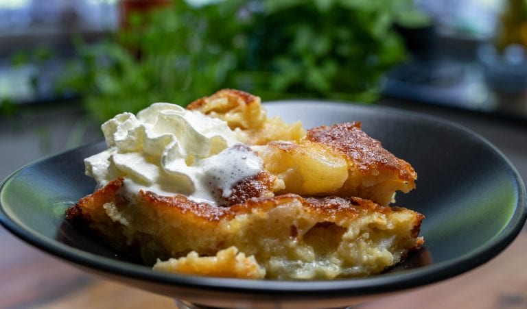 Freshly baked apple pie with a golden crust, ready to be served.